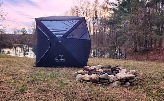 Sweat sauna tent on edge of pond with firepit nearby - Ox Sweat Sauna News