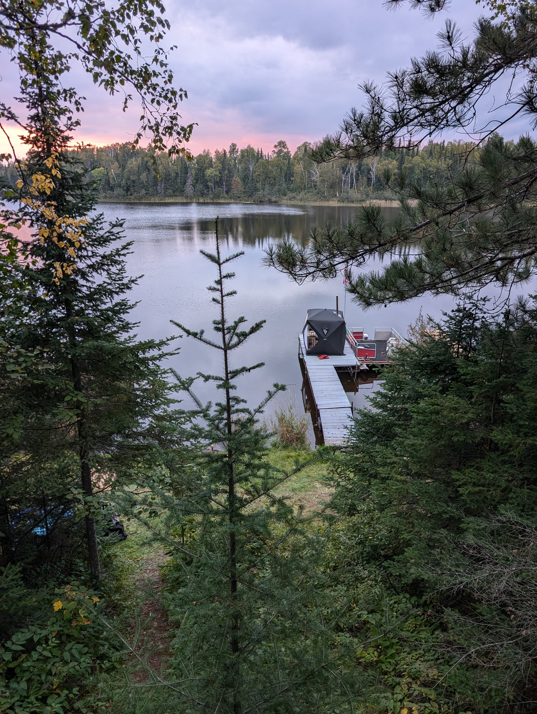 A portable wood fired sauna tent at a vacation rental cabin.
