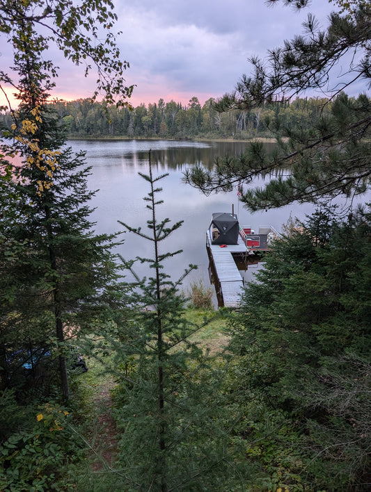 A portable wood fired sauna tent at a vacation rental cabin.