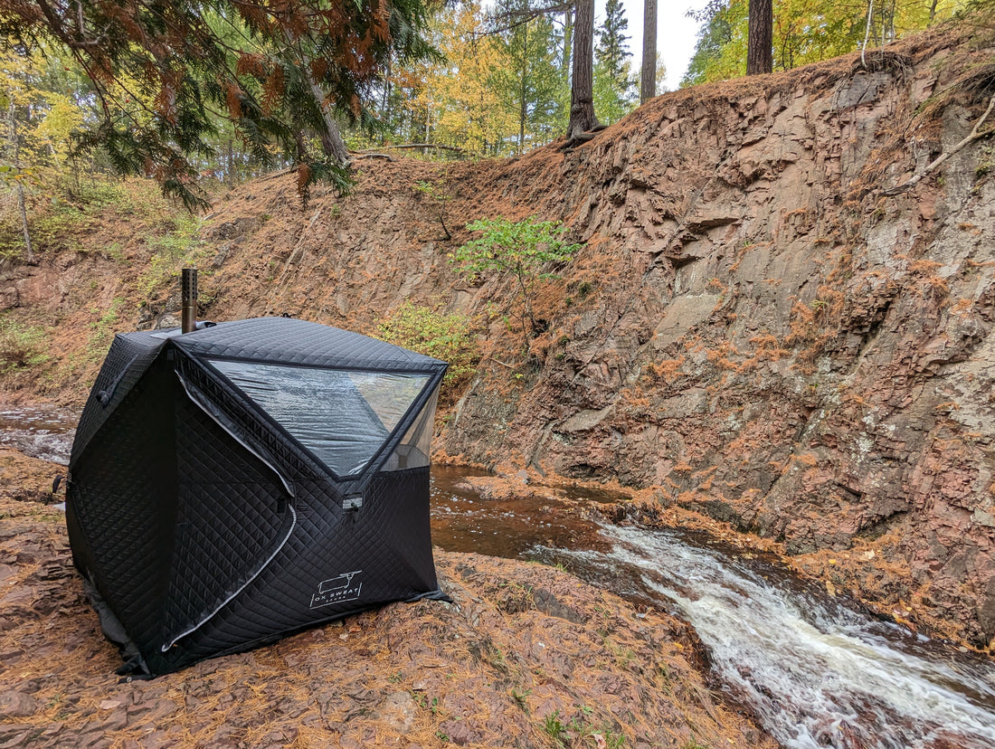 Portable sauna tent location along a beautiful creek in Minnesota