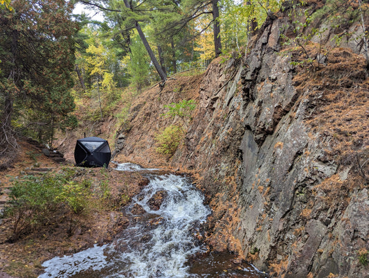 Ox Sweat portable sauna tent along a creek in Northern Minnesota